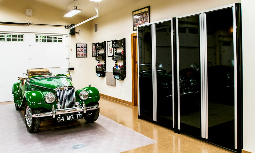 Black Custom Closets in Garage with Green Antique Collector Car