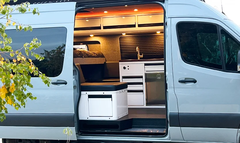 Grey Adventure Van With Custom White Galley Cabinets