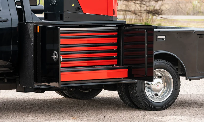 Black Truck Bed With Red Drawers in Compartment
